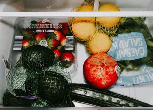 Clean organized refrigerator interior with fresh produce