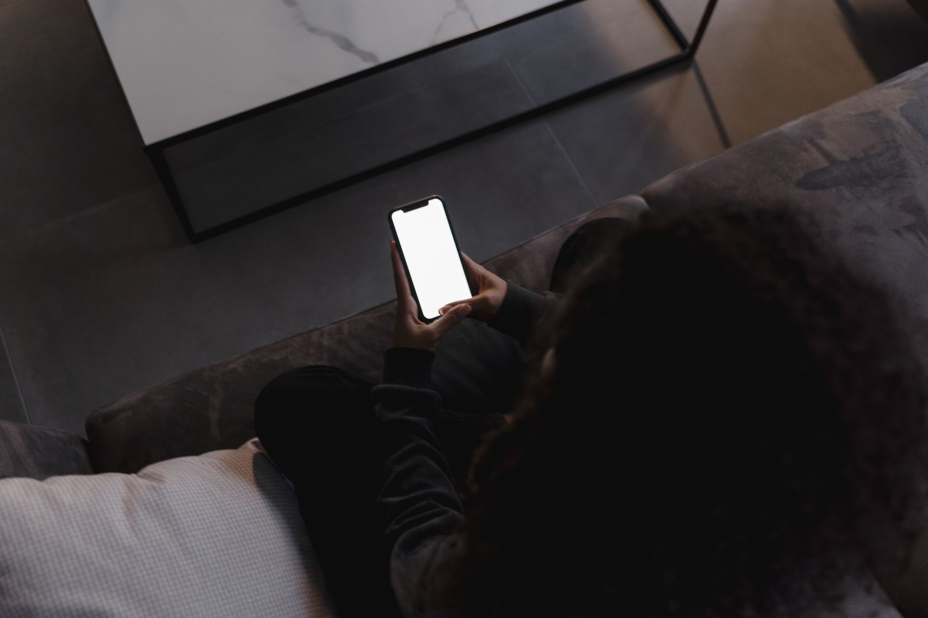 Person comparing mobile phone plans on laptop
