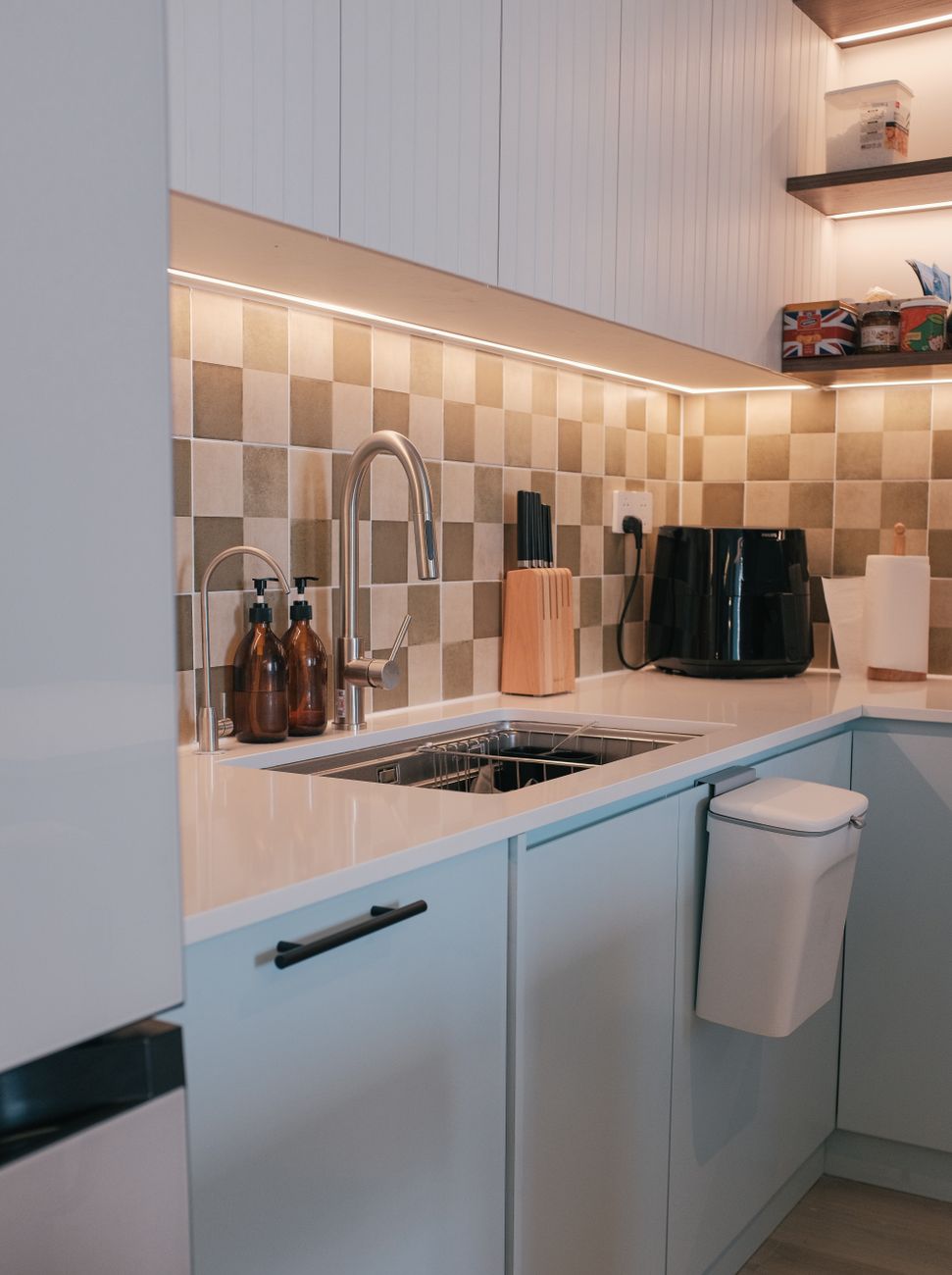 under sink storage, tension rod hack, spray bottles, kitchen organization, cabinet space