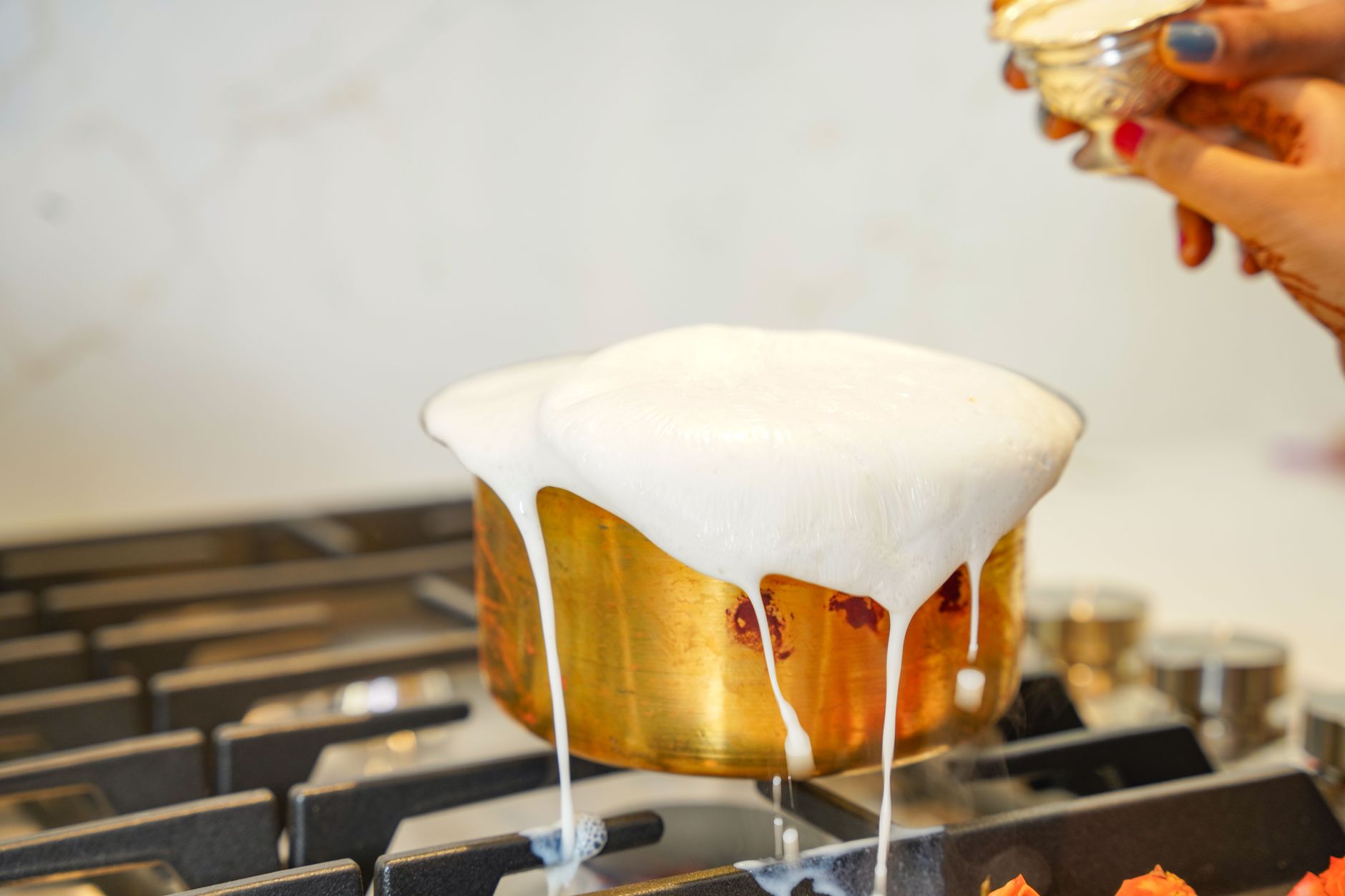 milk boiling over, stove hack, kitchen tip, boil milk, cooking fix